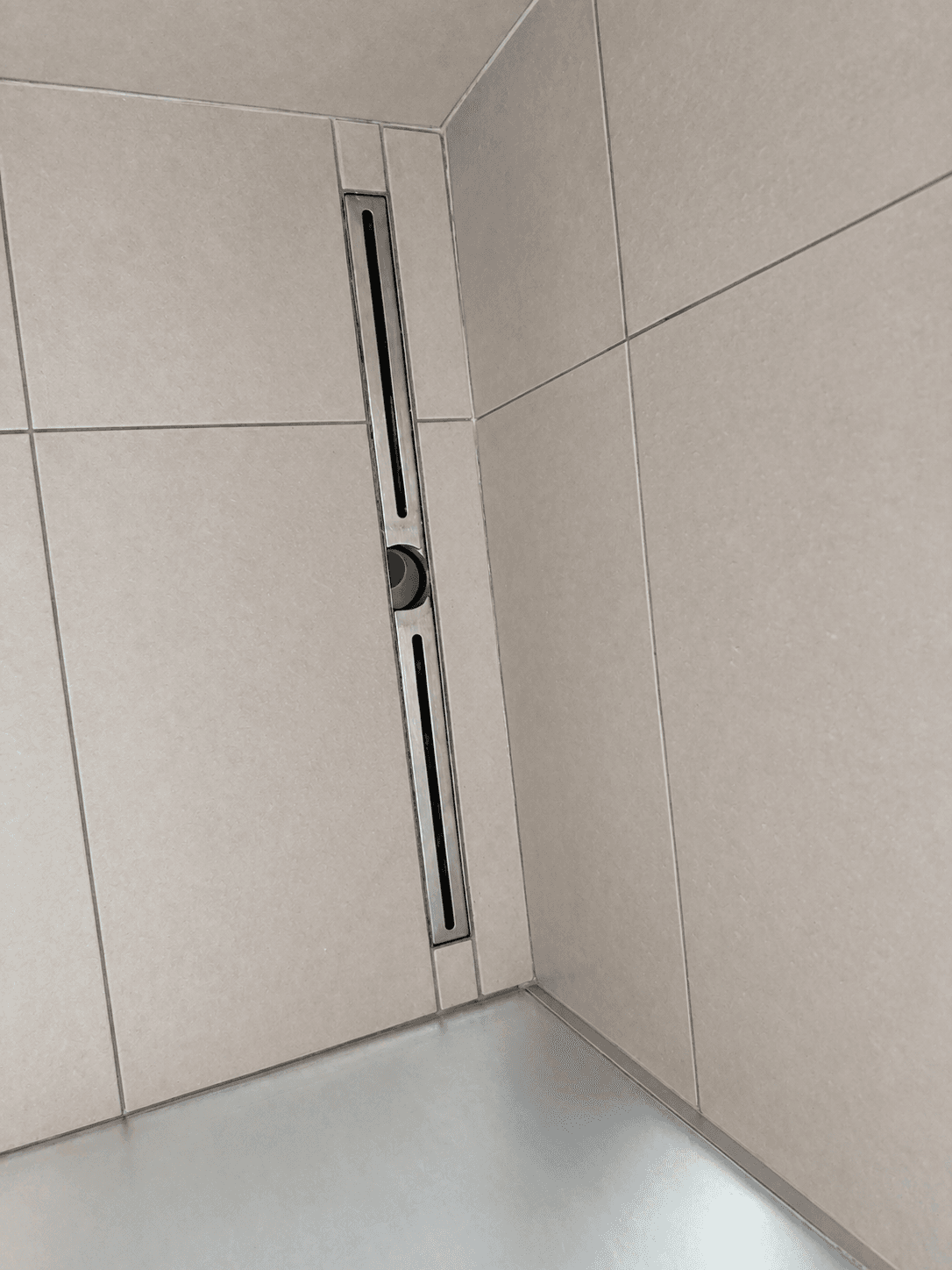 Clean shower tiles and drain after bathroom cleaning