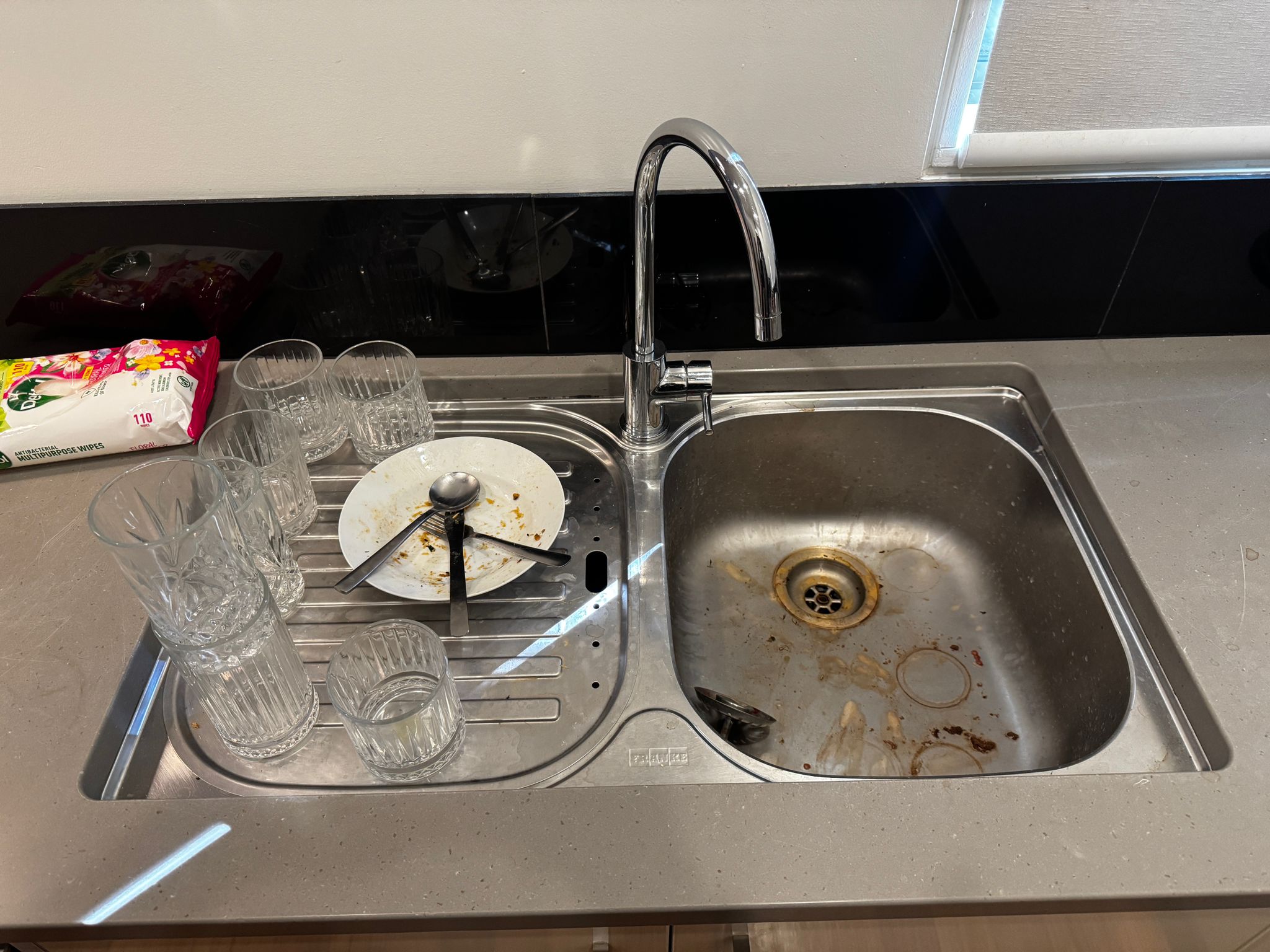 Kitchen sink area before a detailed professional clean